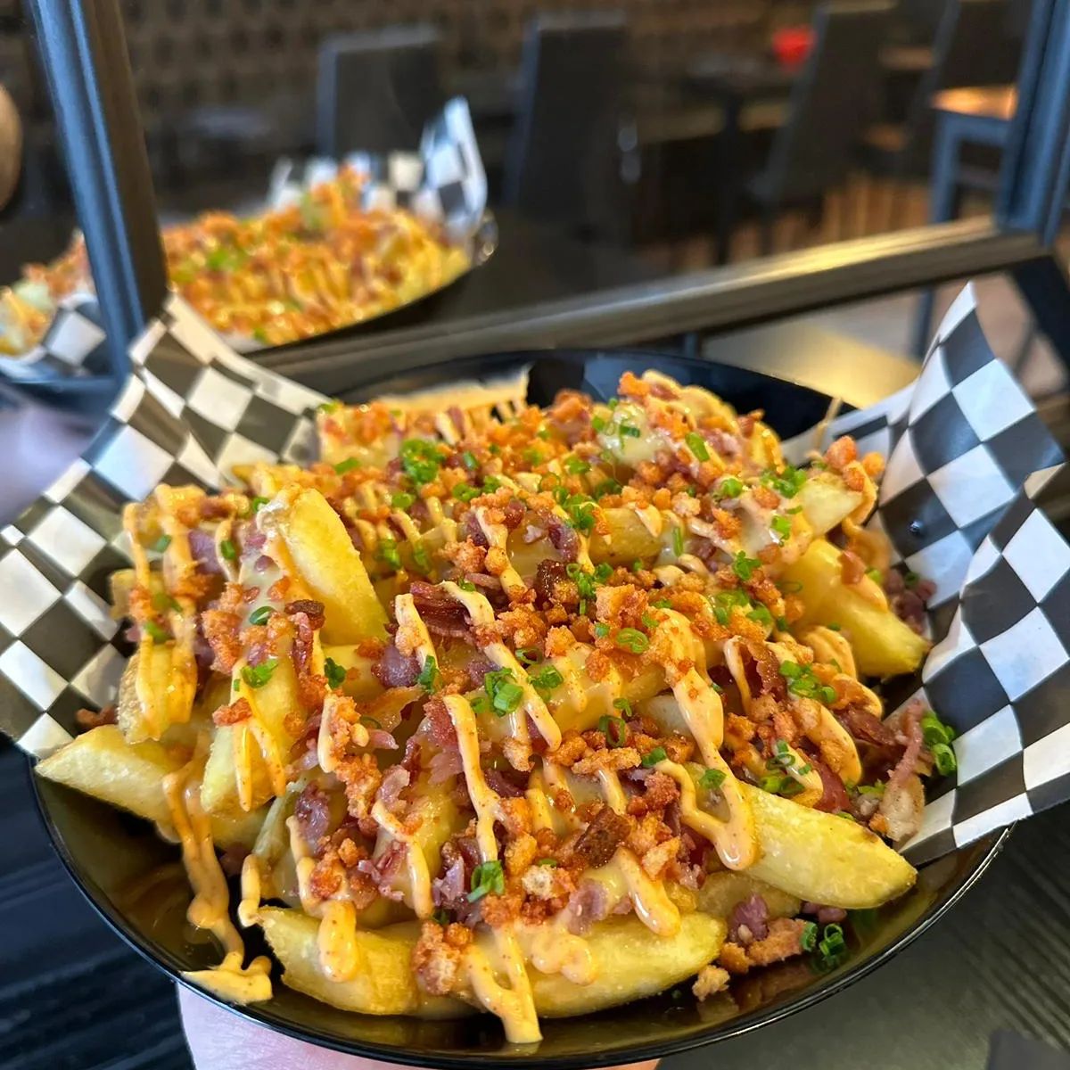 extravagant dirty fries with onions bacon and cheese